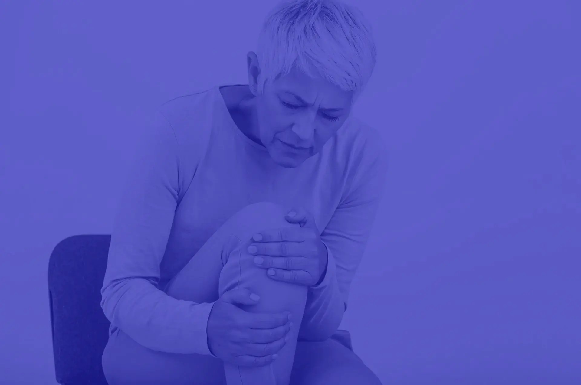 Joint denervation-Senior-woman-holding-the-knee-with-pain