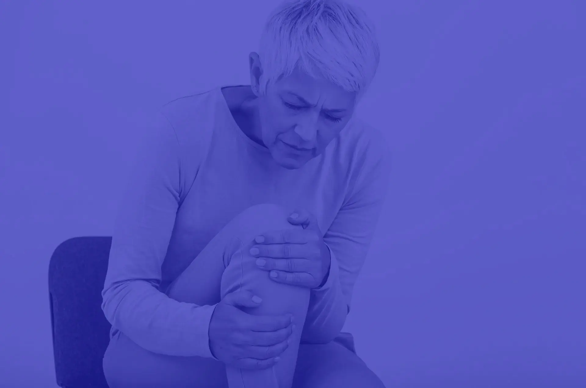 Joint denervation-Senior-woman-holding-the-knee-with-pain